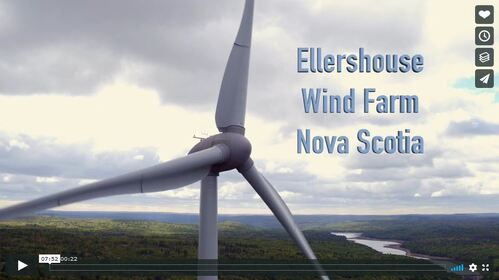 Still image from a video of a turbine with the words Ellershouse Wind Farm Nova Scotia. Click image to be taken to full video
